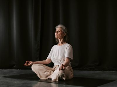 Detail of hands in a yoga mudra position.